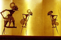 Traditional Wayang kulit puppets projected on to a screen.