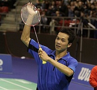 2004 gold medalist in badminton men's singles, Taufik Hidayat cheers the crowd from the court.