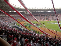 Gelora Bung Karno Stadium, Jakarta, full of fans wearing the Indonesian team colours for Asian Cup match against South Korea, 2007.