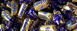 A pils of Cadburys chocolate Eclairs.