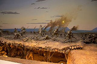 Australian soldiers take a Turkish trench in a diorama of the Battle of Lone Pine.