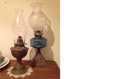 Two rusty lamps with metal bases and glass tops
