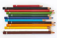 Coloured pencils of various lengths and colours side by side.