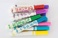 A group of plastic felt-tip pens in a variety of colours.