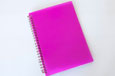 A notebook with spiral binding along the left hand edge.