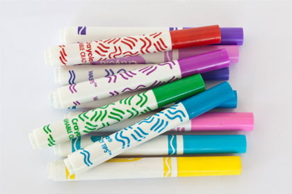 Group of plastic felt-tip pens in a variety of colours.