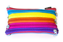 A pencil case made from brightly coloured zippers