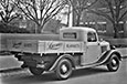 Vintage delivery truck with 'Laconia blankets' printed on the sides.