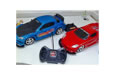 Blue and red remote control cars with remote control.