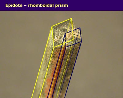 long thin crystals with straight sides, with rhomboidal prism shape highlighted