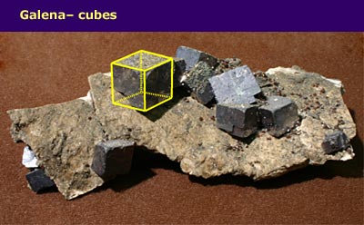 small crystal cubes embedded in rock