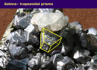 a mass of crystal with trapezoidal prism shape highlighted