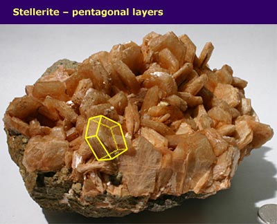 crystals embedded in rock with pentagonal prism shapes highlighted