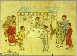 Men standing around a table looking at medical goods