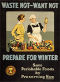 young lady beside an older lady wearing an apron and  showing a bottle of preserves behind a table showing fresh and preserved vegetables