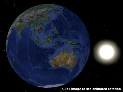 Full globe of the earth showing Asia, Australia and the Pacific regions with the sun behind and to the centre right