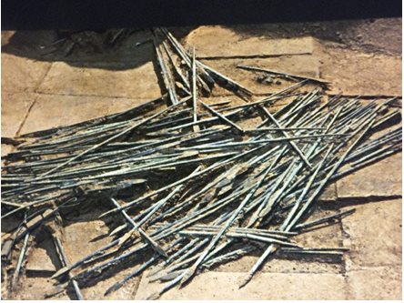 Dozens of arrows lie on the floor of Pit Two