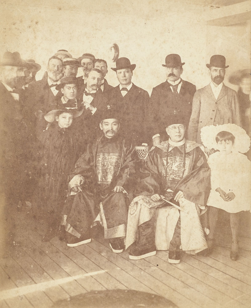 Photograph of several men and two children. Sitting are Quong Tart and Dr On Lee in full mandarin uniform.