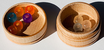 Two containers with beads