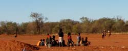 A group of Indigenous Australian children playing in the outback.