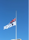 Australian Naval flag flying at half mast