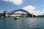 Sydney Harbour Bridge with a ferry arriving at Circular Quay.