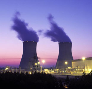 Photo of the Alvin W. Vogtle nuclear power plant in Georgia, USA, with cooling towers against a night sky