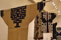 Ainu or Ryuukuu thumbnail: Kimono-style coats with bold patterns hanging from rods