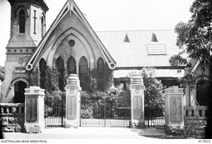 Entrance gates to a school with pillars bearing enrolment names