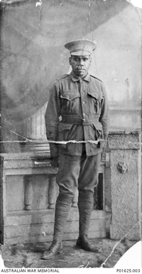 Studio photograph of an Aboriginal man in uniform