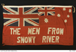 A red flag with a Union Jack in the top left quarter, a small Union Jack and stars of the Southern Cross in the top right quarter and 'The menu from Snowy River' written across the bottom.