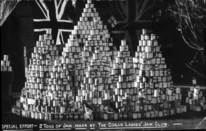 Tine stacked in pyramids in front of a Union Jack flag